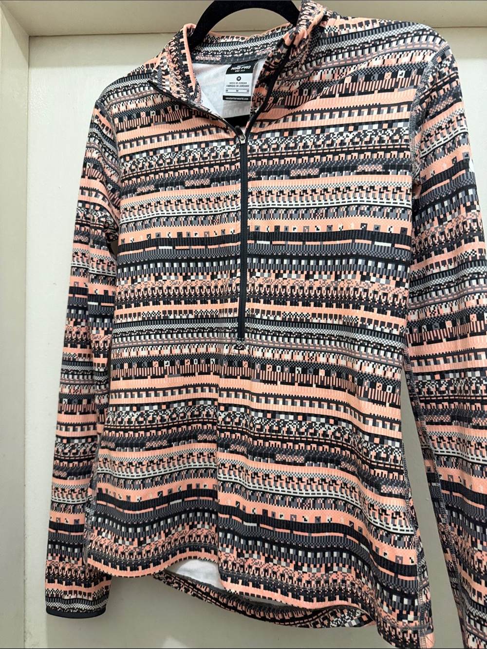 Nike Women's V-Neck Half-Zip Pullover in Peach and Black Geometric Print